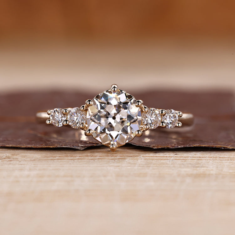 Round old European cut ring five stones six prong set.