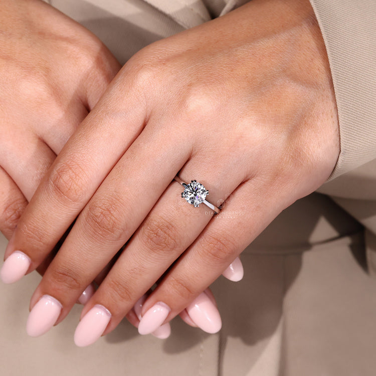 Handmade solitaire engagement ring in custom white gold design.