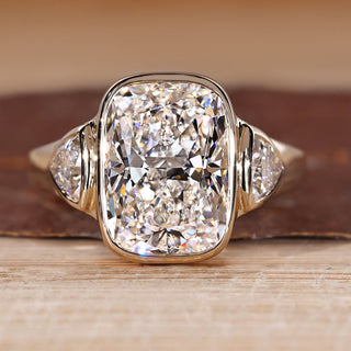 Cushion Cut Diamond Ring with trillion side stones.