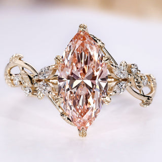 Marquise cut diamond ring with pink diamond.
