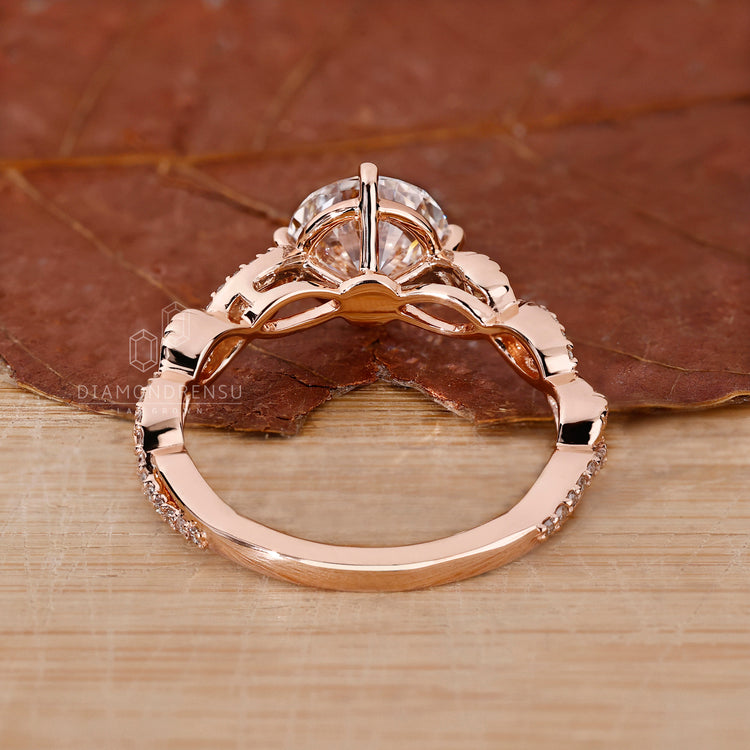Custom diamond ring with rose gold band and pavé details.
