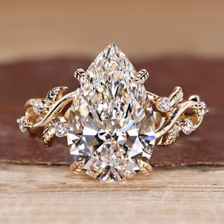 Pear Cut Diamond Ring with round side stones.