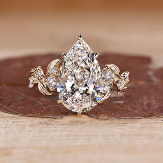 Pear Cut Diamond Engagement Ring with round stones.