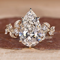 Pear Cut Diamond Engagement Ring with round stones.