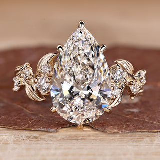 Pear Cut Diamond Engagement Ring with round stones.