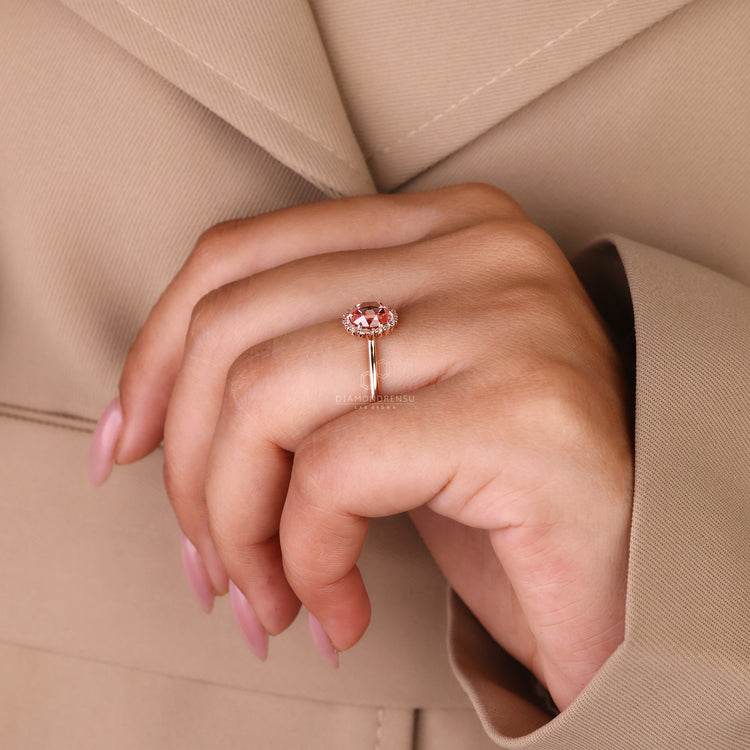Round rose cut ring with pink diamond halo in rose gold.