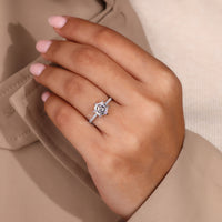 Six claw prong setting ring with hexagon diamond in white gold.
