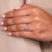 Round cut side stone adds shine to half pave ring.