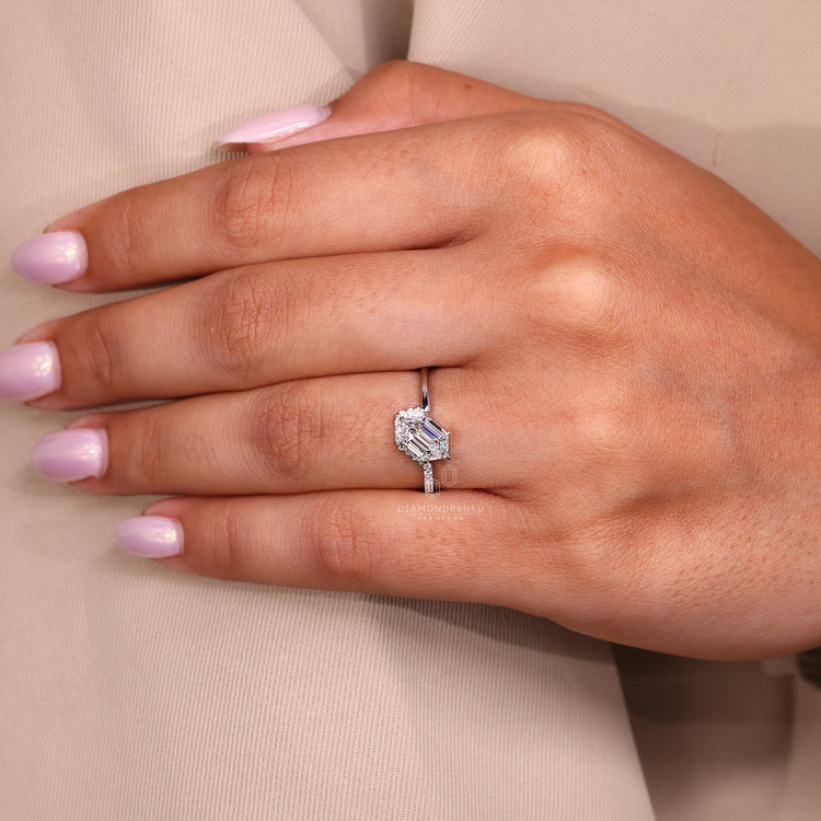 Round cut side stone adds shine to half pave ring.