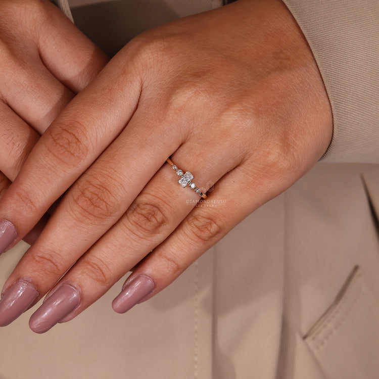 Round cut side stone yellow gold engagement ring.