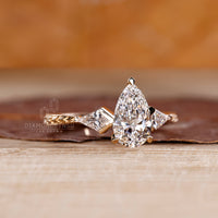 Lab grown pear diamond ring kite three stone style.