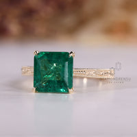 Asscher emerald ring milgrain four claw prong set.