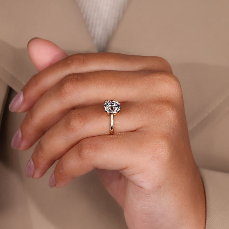 Cushion old European cut ring four claw solitaire style.