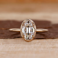 Solitaire diamond engagement ring with old mine oval cut diamond.