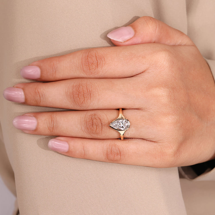 Handmade pear cut diamond ring bezel prong style.