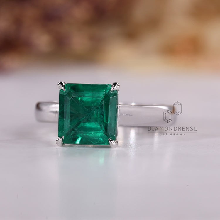 Handmade Asscher emerald ring solitaire cathedral set.