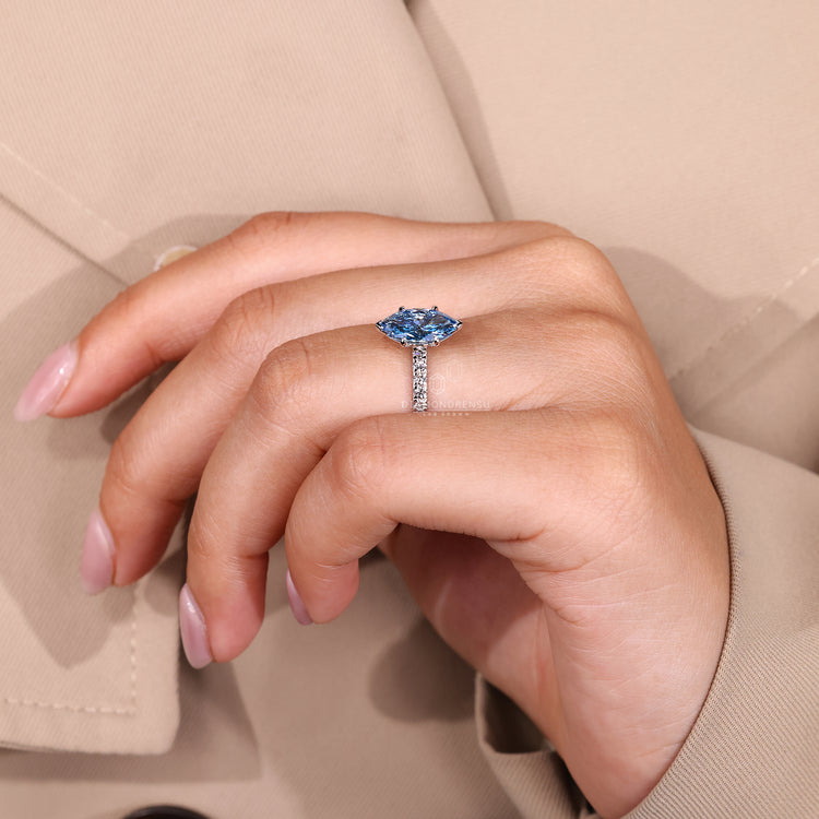 Round diamond pave band marquise engagement ring.