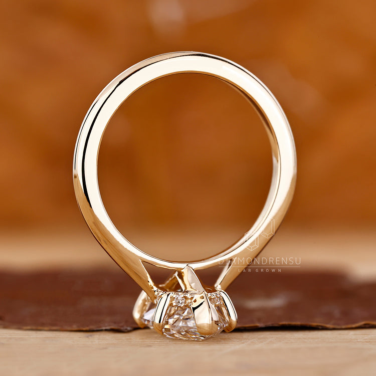 Marquise diamond ring tapered shank hidden halo set.