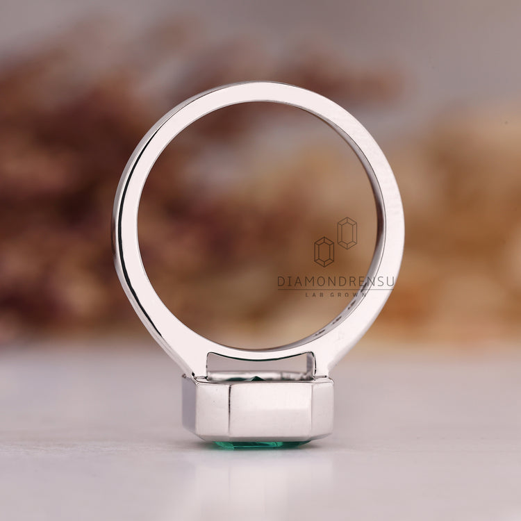 Asscher cut emerald ring handmade bezel channel design.
