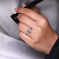 Portuguese cut diamond ring cathedral four claw prong.