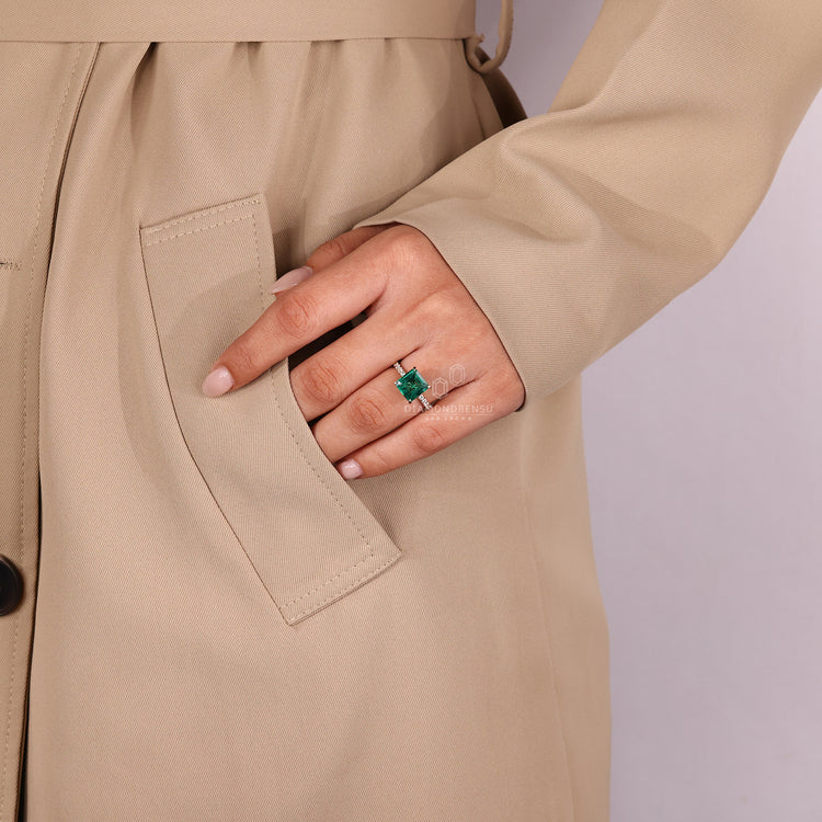 Asscher cut emerald ring round diamond pave band.