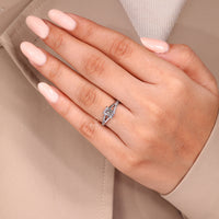 Emerald cut diamond ring four claw split shank pave style.