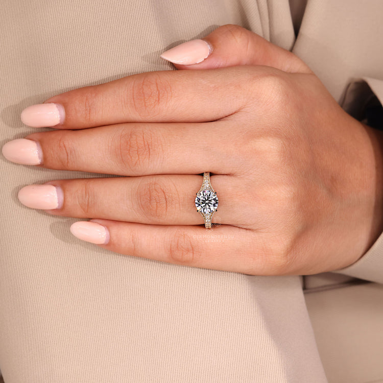 Handmade round cut diamond ring tapered pave design.