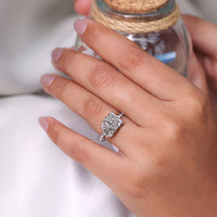 Toi et moi ring pear radiant claw prong setting.