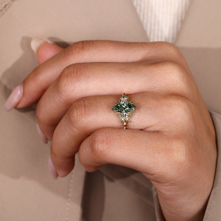 Marquise diamond ring trillion and emerald accents.
