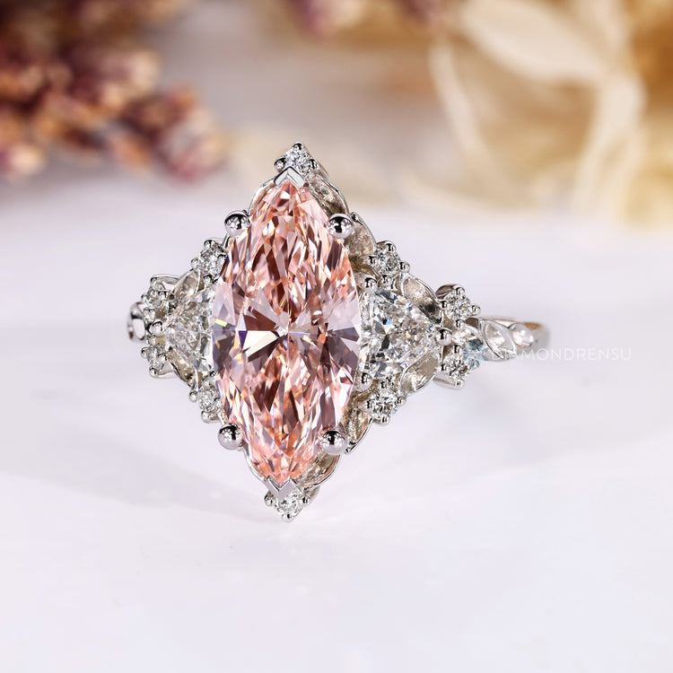 Vintage marquise cut diamond ring with pink diamond.
