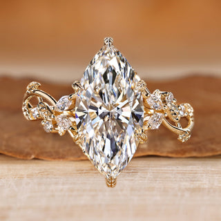 Marquise diamond ring with marquise and round side stones.