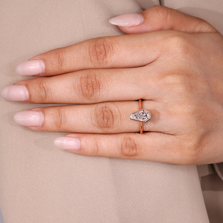 Coffin cut ring solitaire bezel setting design.
