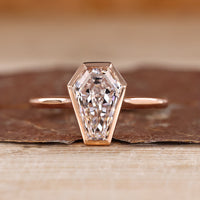 Coffin cut diamond ring bezel cathedral solitaire.