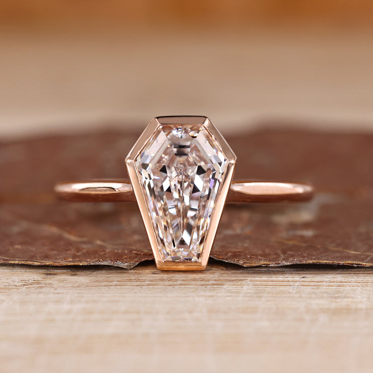 Coffin cut diamond ring bezel cathedral solitaire.