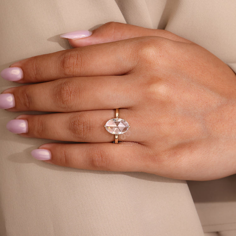 Oval rose cut diamond ring open gallery prong set.