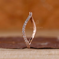 Round cut diamond band half eternity ocean wave style.