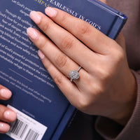 Lab grown elongated cushion cut diamond ring in cathedral setting.