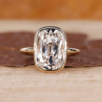 Bezel diamond ring with cushion old European cut centre.