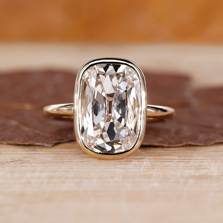 Bezel diamond ring with cushion old European cut centre.