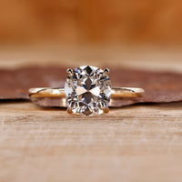 Cushion old European cut ring solitaire four claw set.