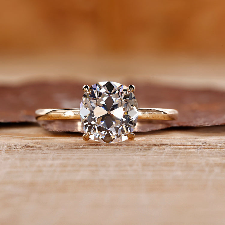 Cushion old European cut ring solitaire four claw set.