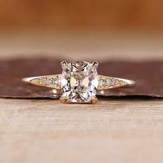 Cushion Old European Cut Ring with round side stones.