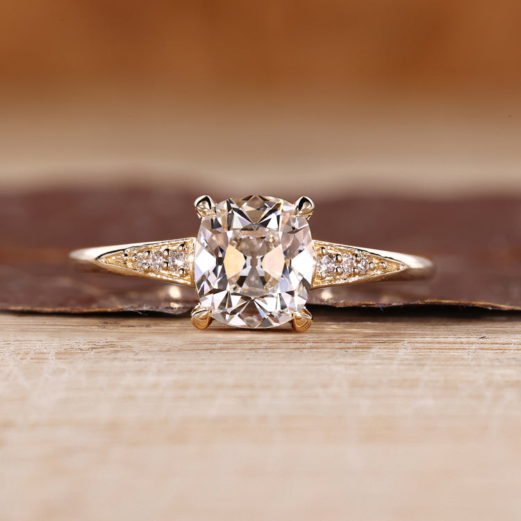 Cushion Old European Cut Ring with round side stones.