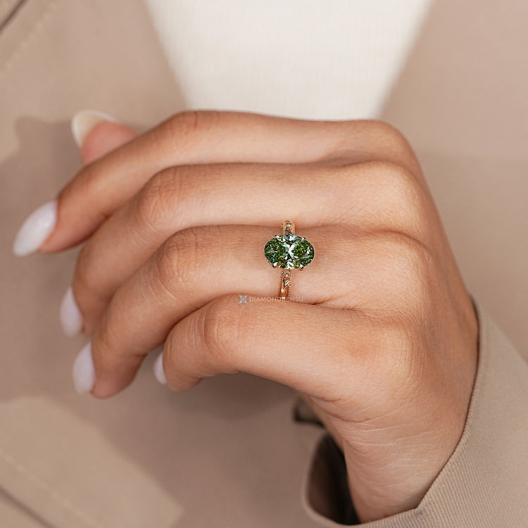 Lab grown oval diamond ring with round diamond accent.