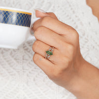 Green marquise diamond ring with tulip basket setting.