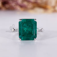 Emerald cut emerald ring distance pave marquise round.