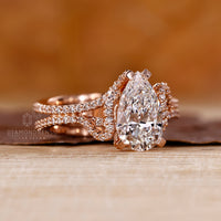 Hidden halo pear diamond ring double pave prong set.