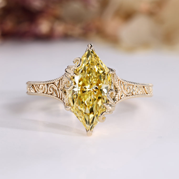 Dutch marquise diamond ring with yellow diamond.