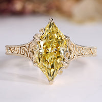 Dutch marquise diamond ring with yellow diamond.