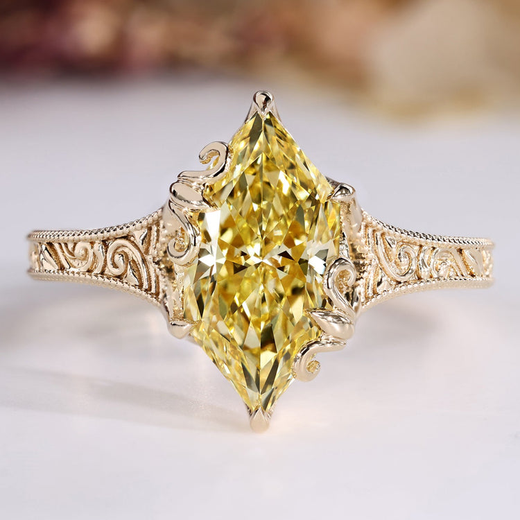 Dutch marquise diamond ring with yellow diamond.